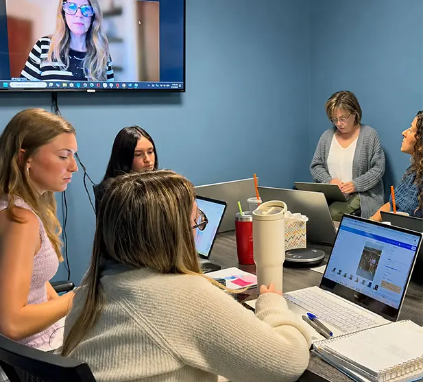 Client team collaborating in office